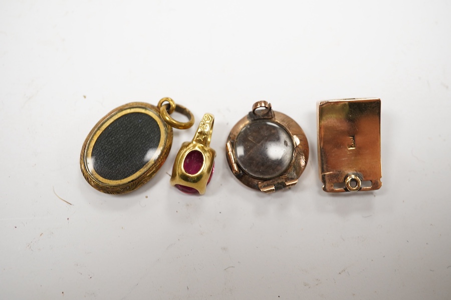 A modern 18k and gem set small pendant 10mm, one earlier yellow metal pendant, a yellow metal and gem set clasp and a damaged mourning brooch. Condition - poor to fair